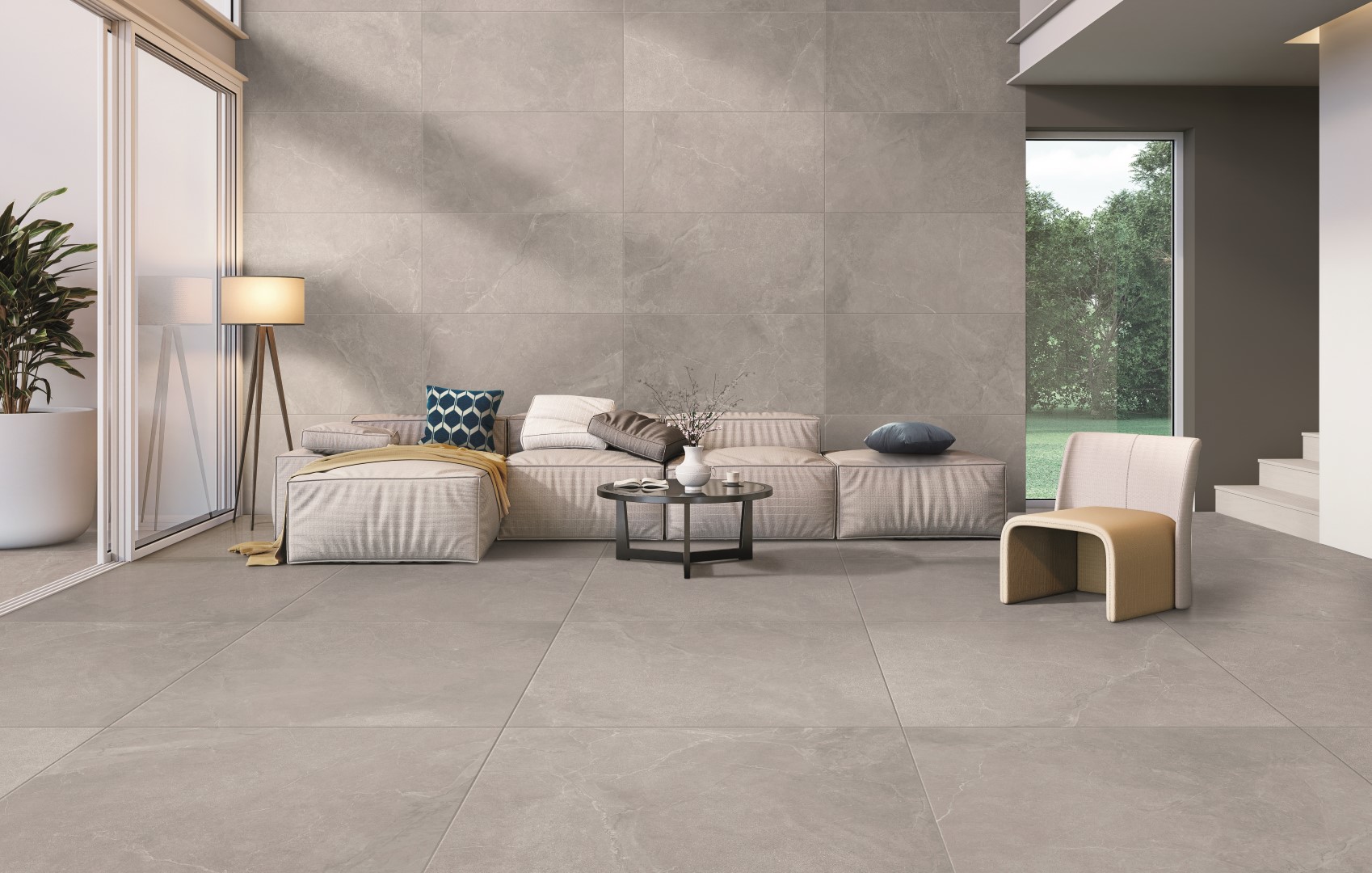 Eleganza minimal con grandi formati effetto pietra su parete e pavimento